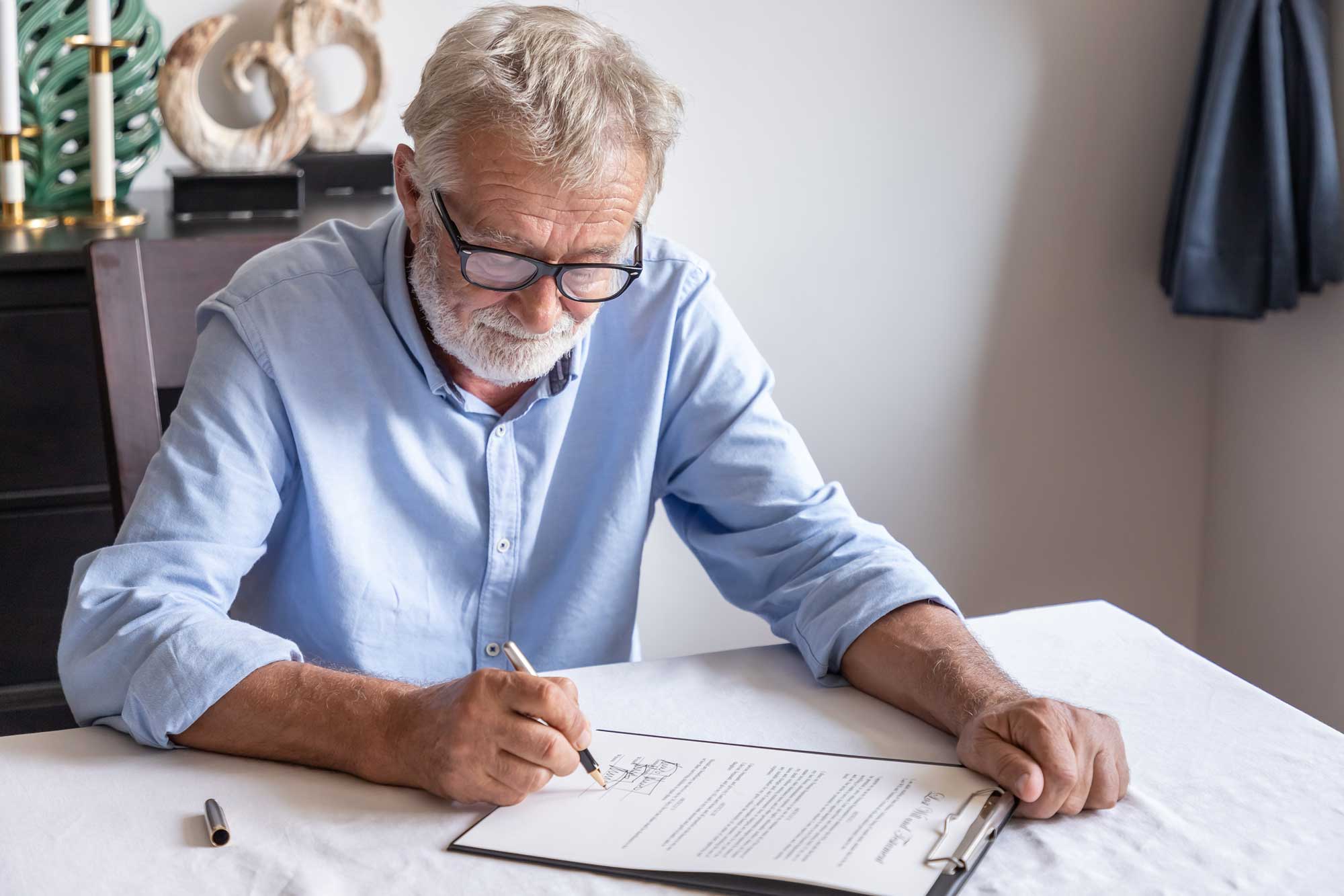man looking at financial documents